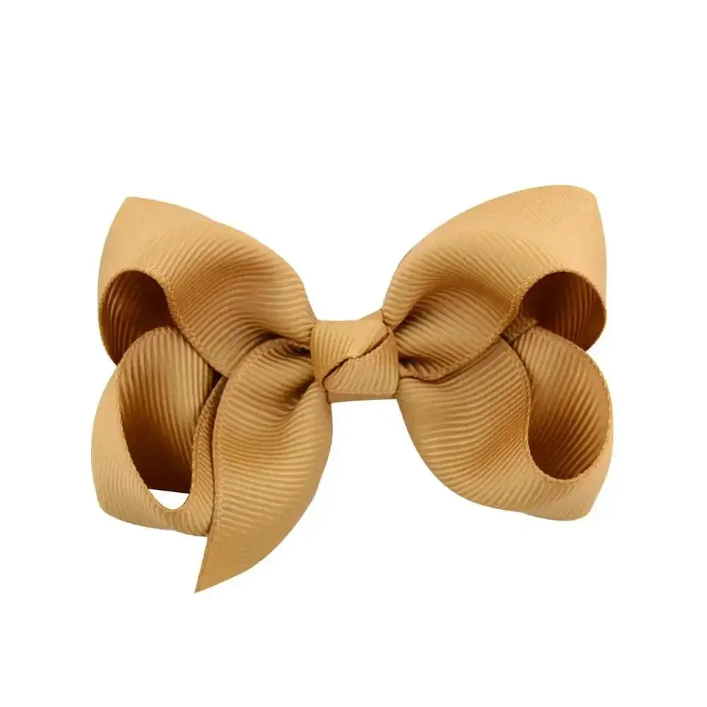 Large mustard yellow bow on a white background