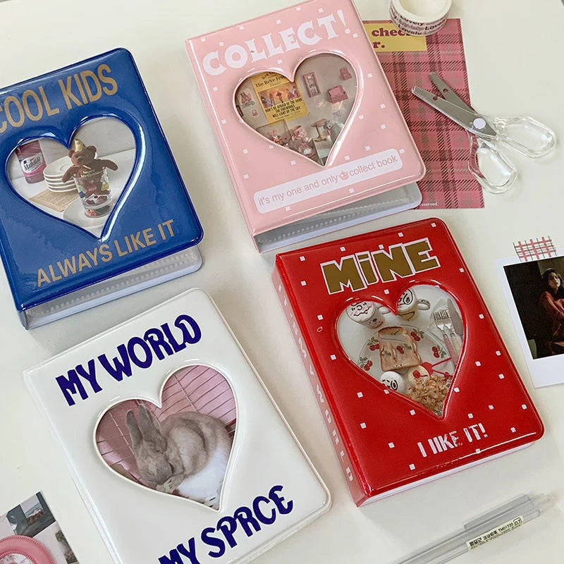 Collection of heart-shaped photo frames on a white surface with scissors and other items.