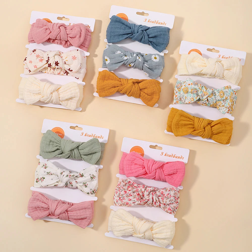 Assorted colorful headbands in packaging on a beige background