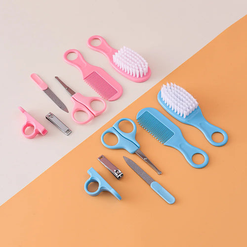 Set of grooming tools including brushes, scissors, and nail clippers on a two-tone background