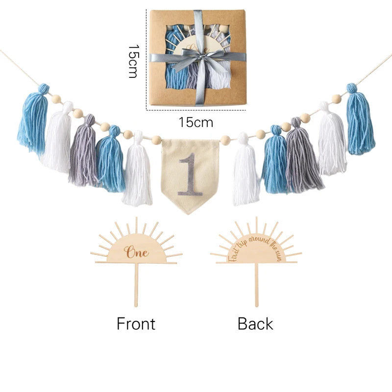 Decorative tassel garland with a banner and cupcake toppers on a white background.