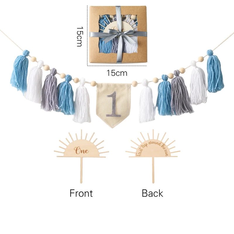 Decorative tassel garland with a banner and cupcake toppers on a white background.