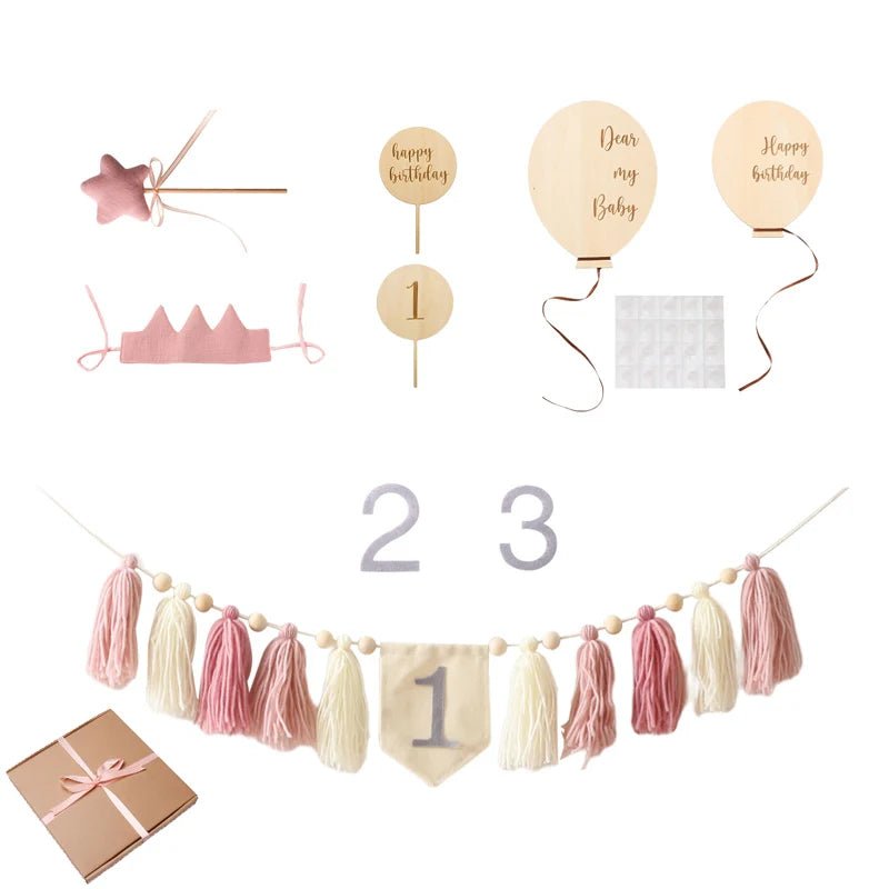 Collection of birthday-themed decorations including balloons, tassels, and a gift box on a white background.