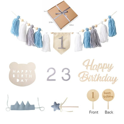 Collection of birthday-themed decorations including tassel garlands, number banners, and themed accessories.