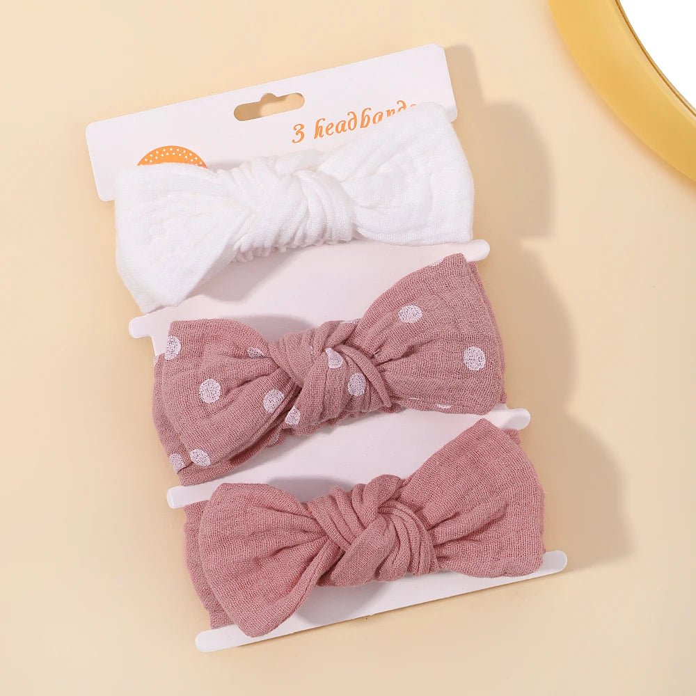 Set of three headbands with different designs on a beige background