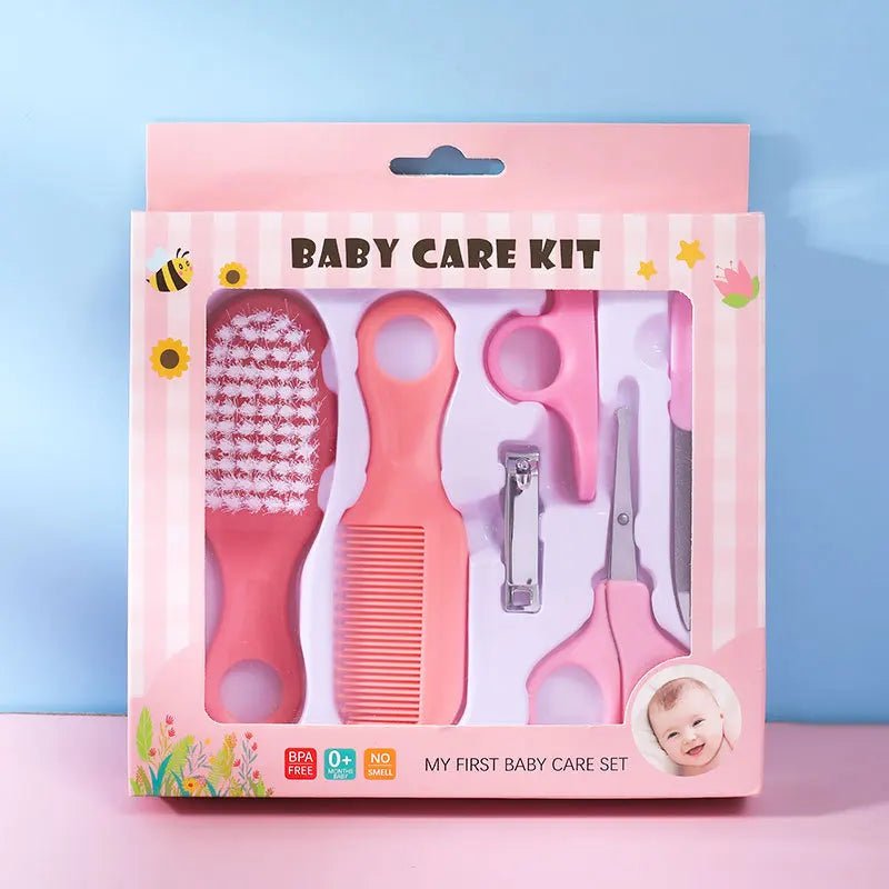 Pink baby care kit with tools on a blue background