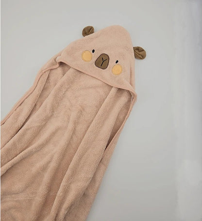 Beige hooded towel with bear face design on a light gray background