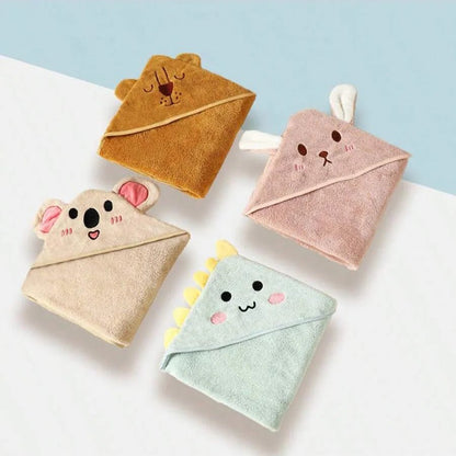 Four cute animal-themed hooded towels on a light blue background