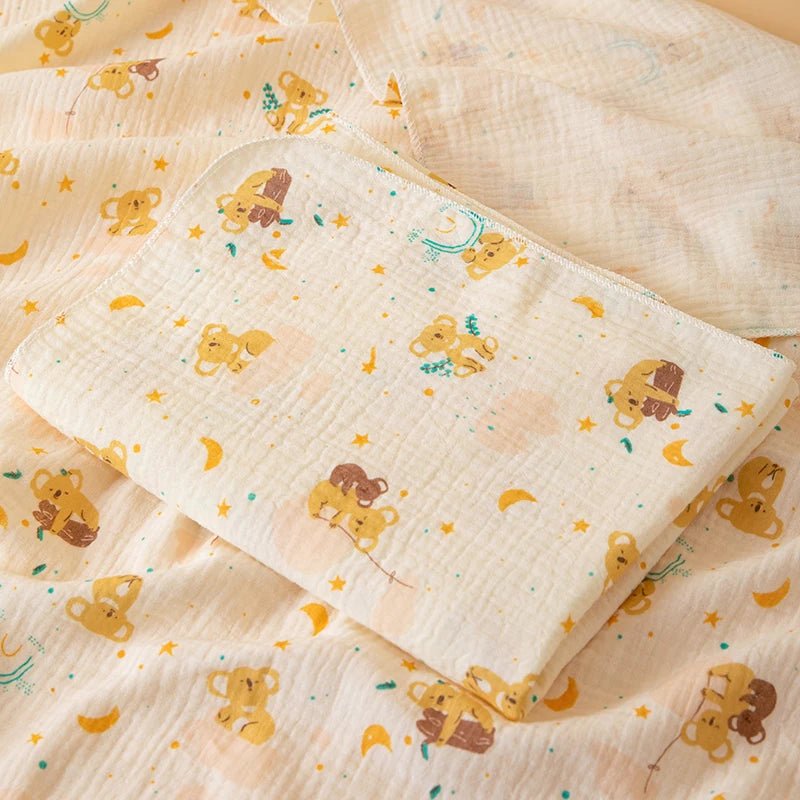 Baby blanket with teddy bear pattern on a matching fabric background