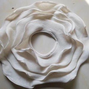 White ceramic flower on a white background