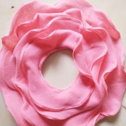 Pink fabric flower on a light background