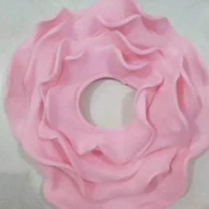 Pink flower-shaped object on a light background