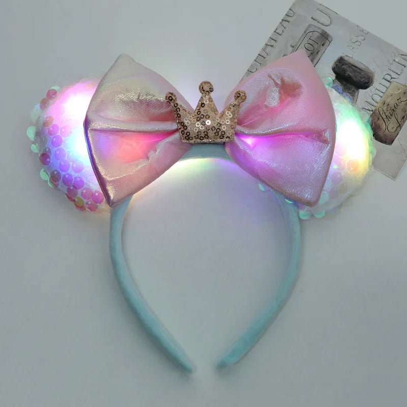 LED bow headband with a crown on a light gray background