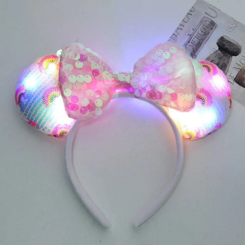 LED light-up bow headband with colorful design on a white surface