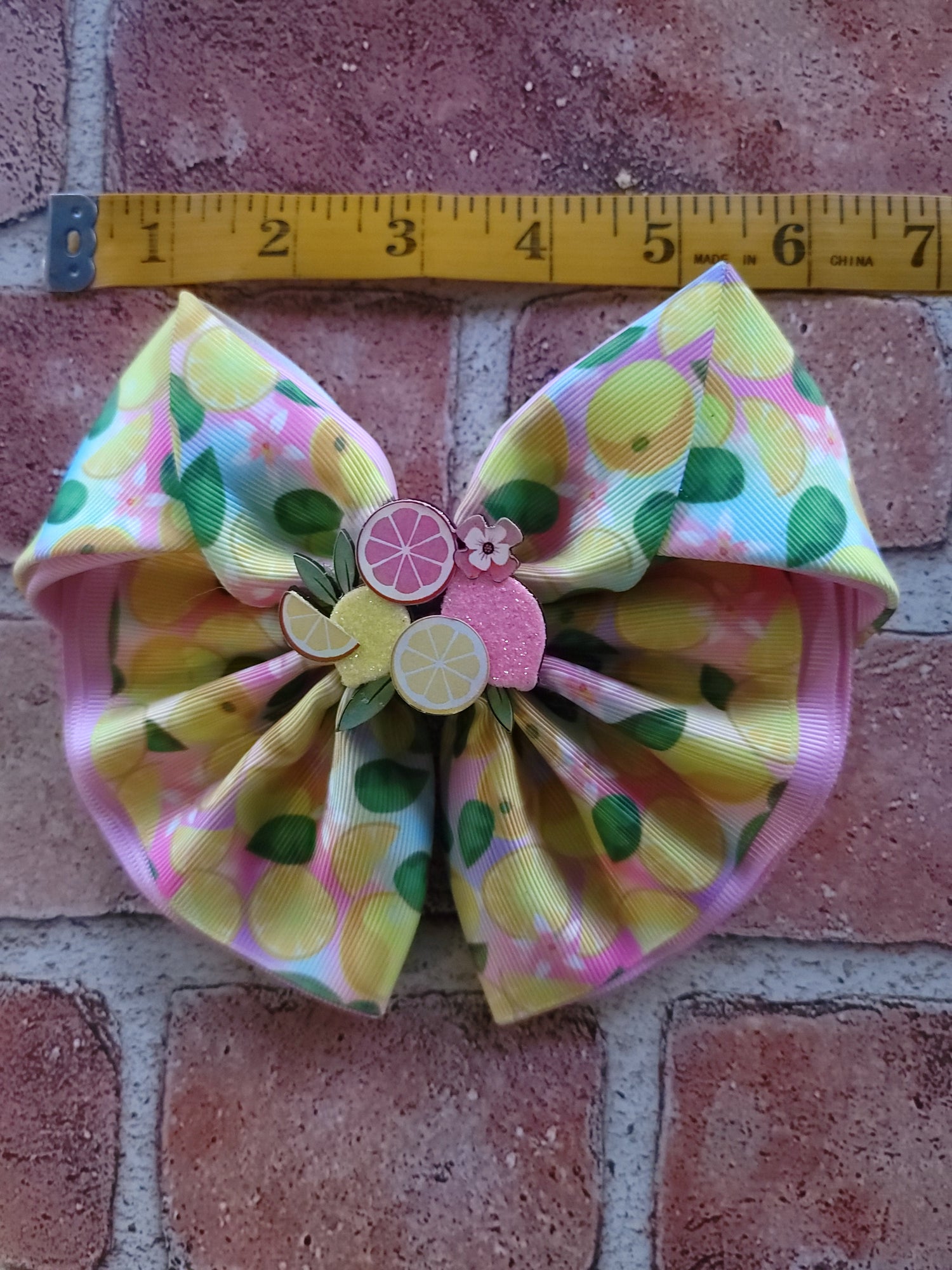 Lemon Citrus Bow With a brick background