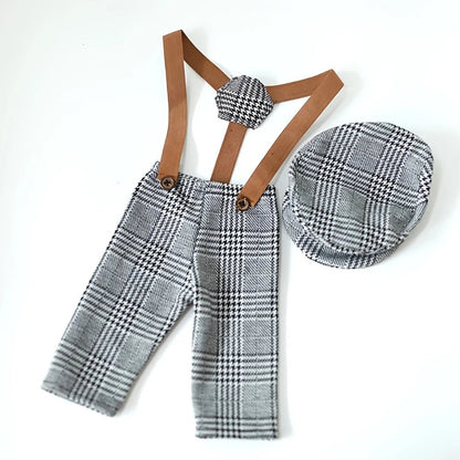 Plaid pants with suspenders and matching hat on a white background