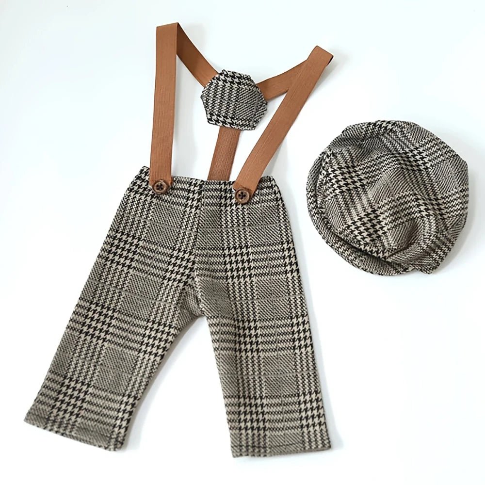 Plaid pants with suspenders and matching hat on a white background