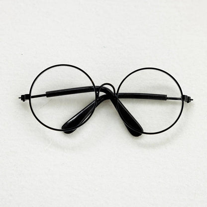 Black round eyeglasses on a white background