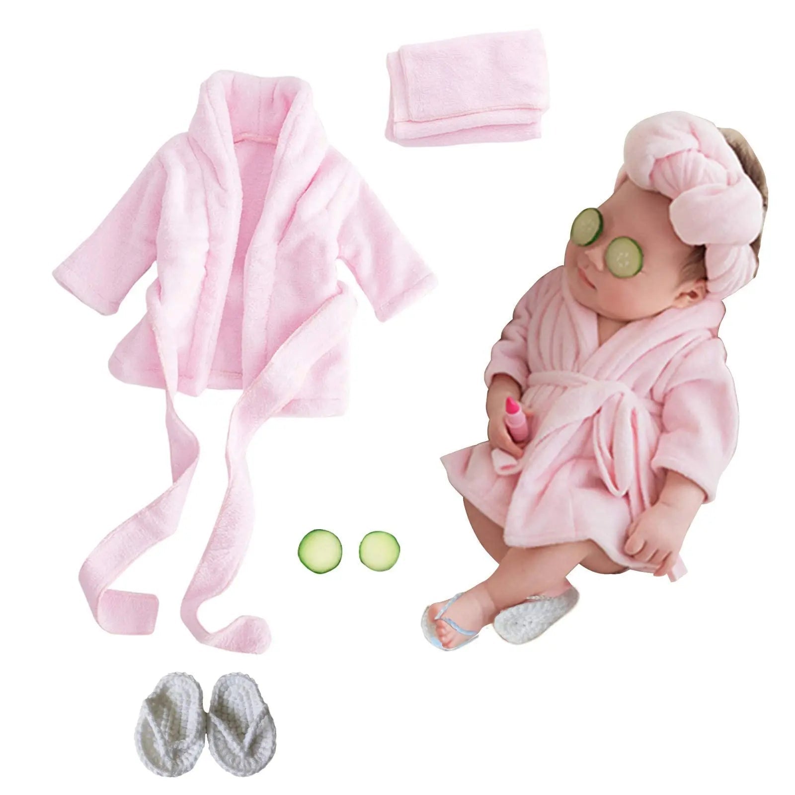 Baby in pink robe with accessories on a white background