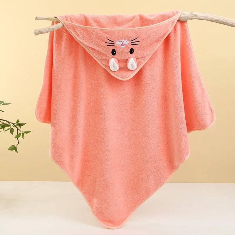 Pink baby blanket with cartoon face on a wooden stick against a yellow background