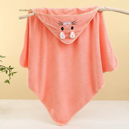 Pink baby blanket with cartoon face on a wooden stick against a yellow background