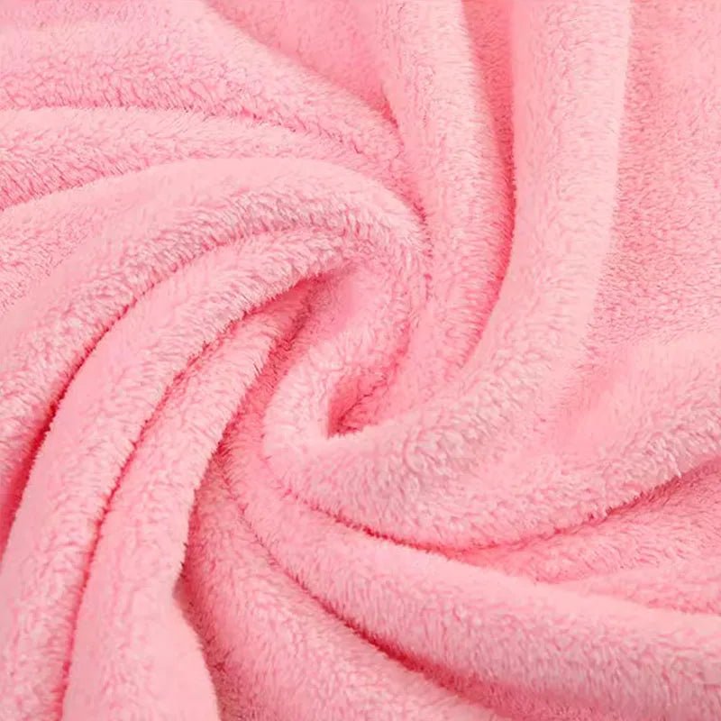 Close-up of pink plush fabric with a soft texture