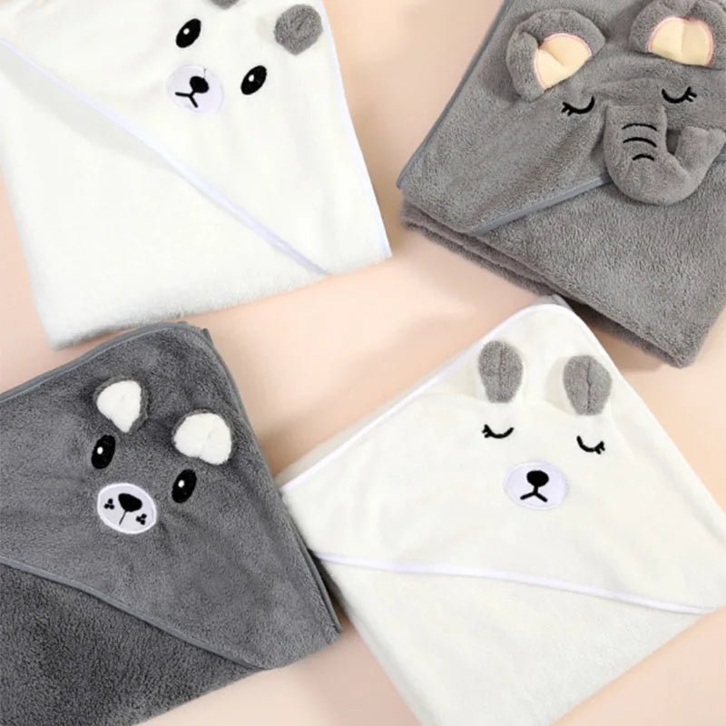 Cute animal-themed hooded towels on a neutral background