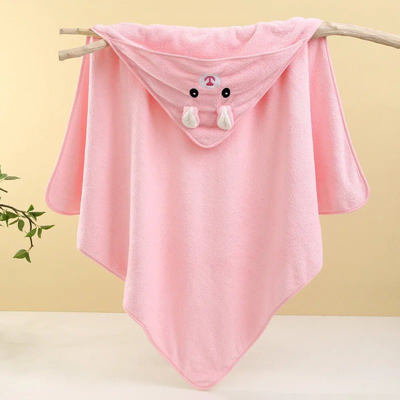 Pink hooded towel with cartoon character on a branch against a yellow background