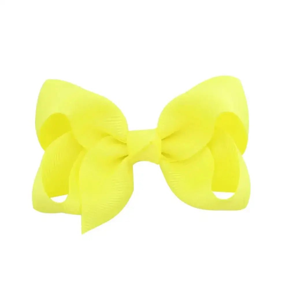 Yellow hair bow on a white background