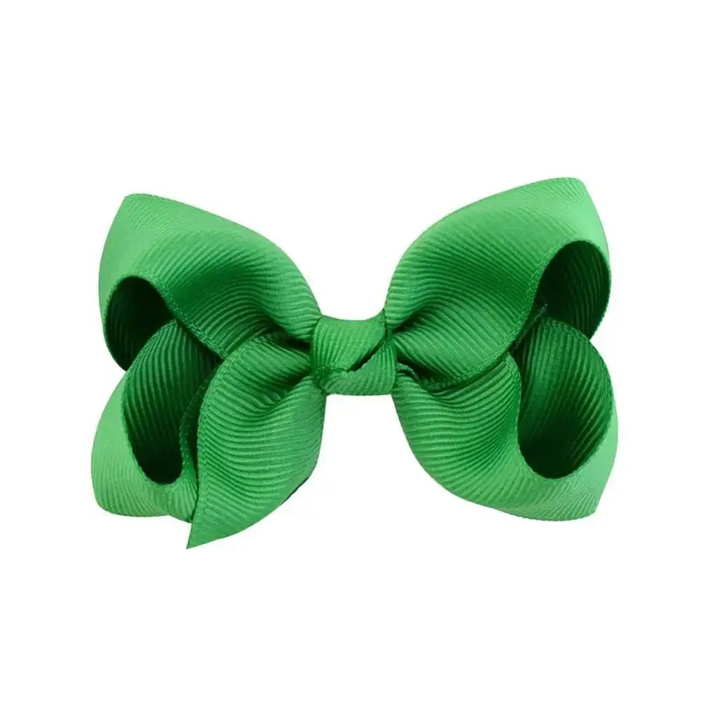 Green hair bow on a white background