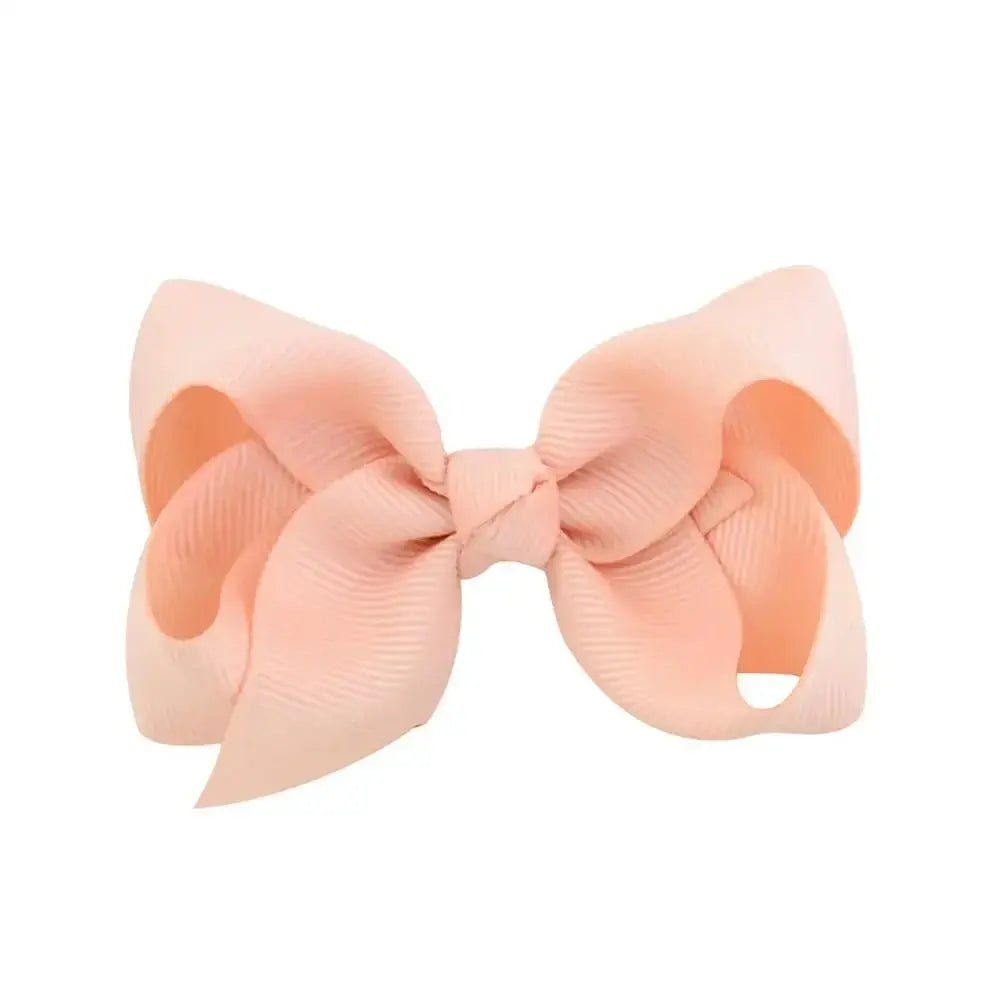 Large peach-colored bow on a white background